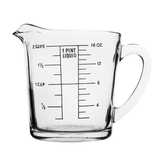 Clear glass measuring cup with black printed measurement markings for cups and ounces, shown on a plain white background.